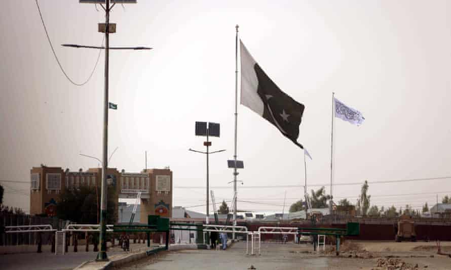 A Taliban flag is raised on the Afghan side of the Pakistani-Afghan border.