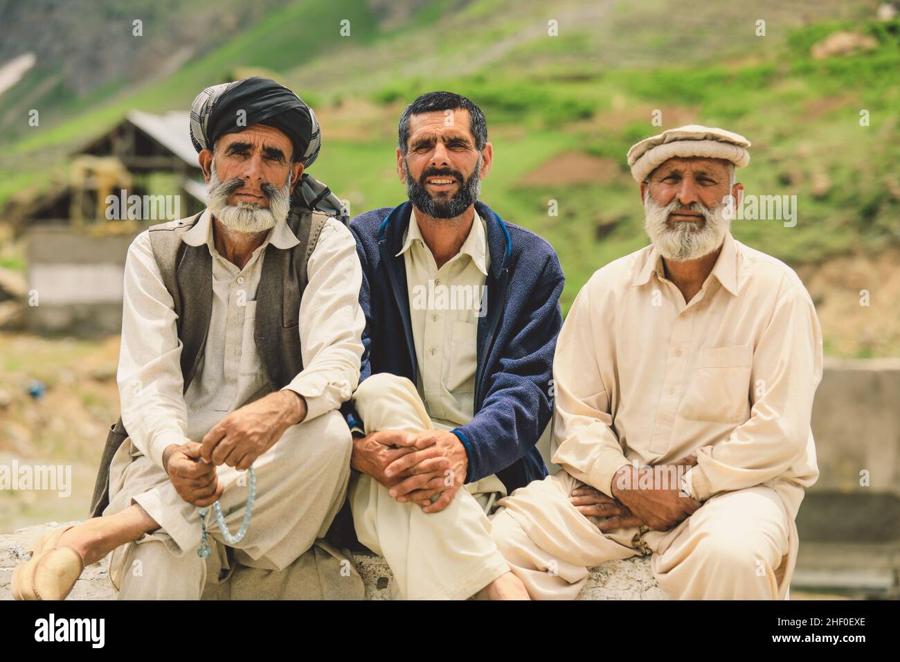 gilgit-pakistan-june-08-2020-group-of-an-pakistani-men-in-traditional-pakol-smiling-and-posing-for-the-picture-2HF0EXE.jpg