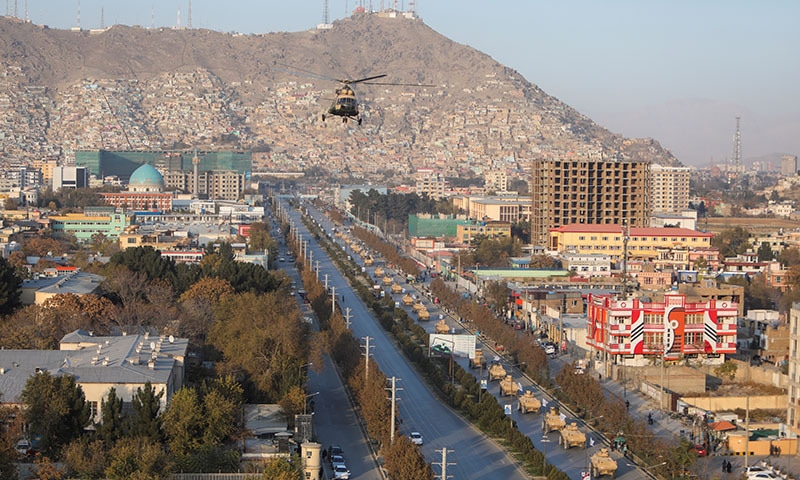 A military helicopter is pictured during the Taliban military parade in Kabul, Afghanistan, on November 14, 2021. — Reuters