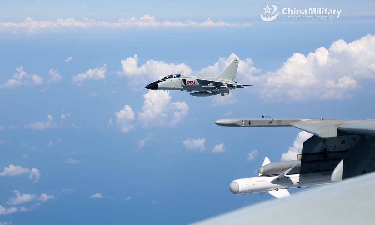 Fighter bombers attached to a naval aviation brigade under the PLA Northern Theater Command fly in line formation during a recent combat readiness patrol recently.Photo:China Military