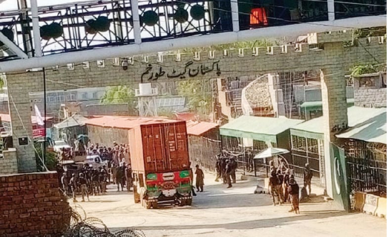 A truck enters Afghanistan at Torkham border crossing on Sunday. — Dawn