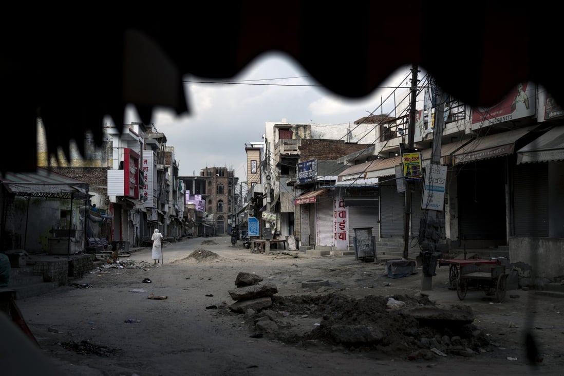 An elderly man walks through an area deserted after communal clashes in Nuh, India’s Haryana state, earlier this month. Photo: AP