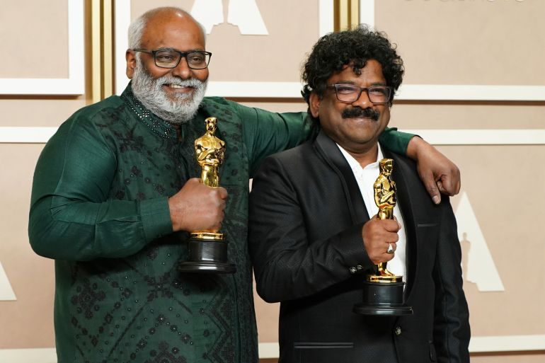 M.M. Keeravaani, left, and Chandrabose, winners of the award for best original song for Naatu Naatu from RRR, pose in the press room at the Oscars