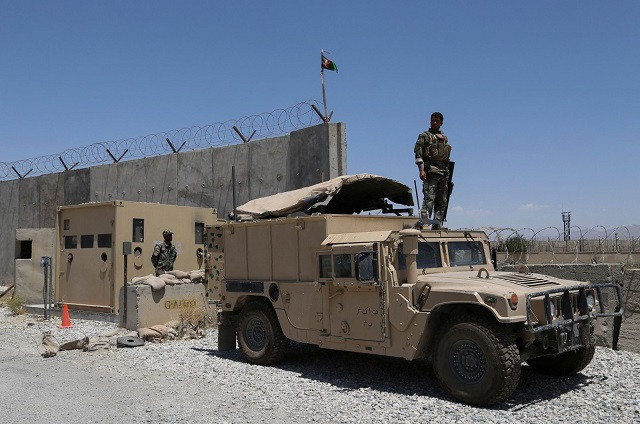 an afghan national army ana soldier looks out while standing on a humvee vehicle at bagram air base after all us and nato troops left some 70km north of kabul july 2 2021 photo afp