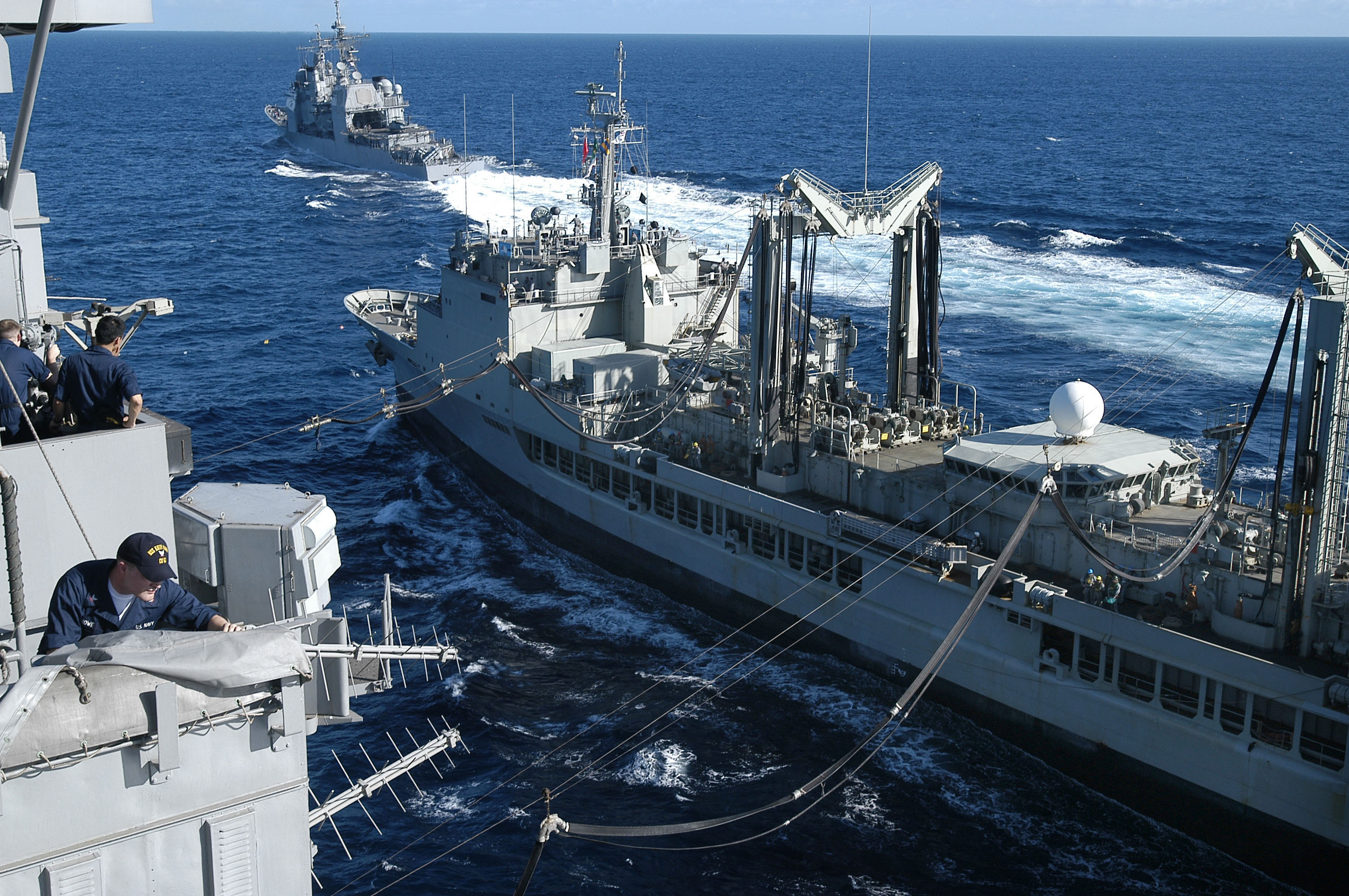 US_Navy_050614-N-0167B-050_Sailors_aboard_USS_Kitty_Hawk_(CV_63)_observe_a_replenishment_at_sea_with_Royal_Australian_Navy_auxiliary_oiler_replenishment_ship_HMAS_Success_(AOR_304)_as_USS_Cowpens_(CG_63)_sails_ahead.jpg