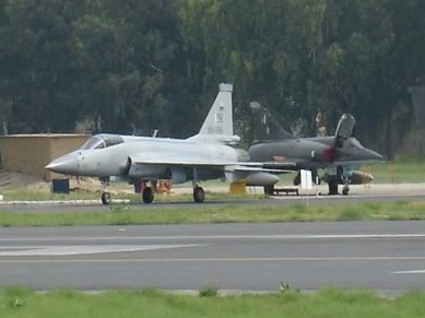 One_JF-17_in_front_of_two_parked_Mirage_5_cropped_version.jpg