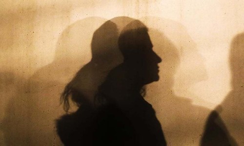 A woman's silhouette  is seen in this file photo. — AP