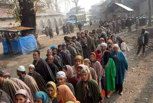 People-in-queue-outside-a-polling-booth-to-cast-their-vote-in-Ganderbal.jpg