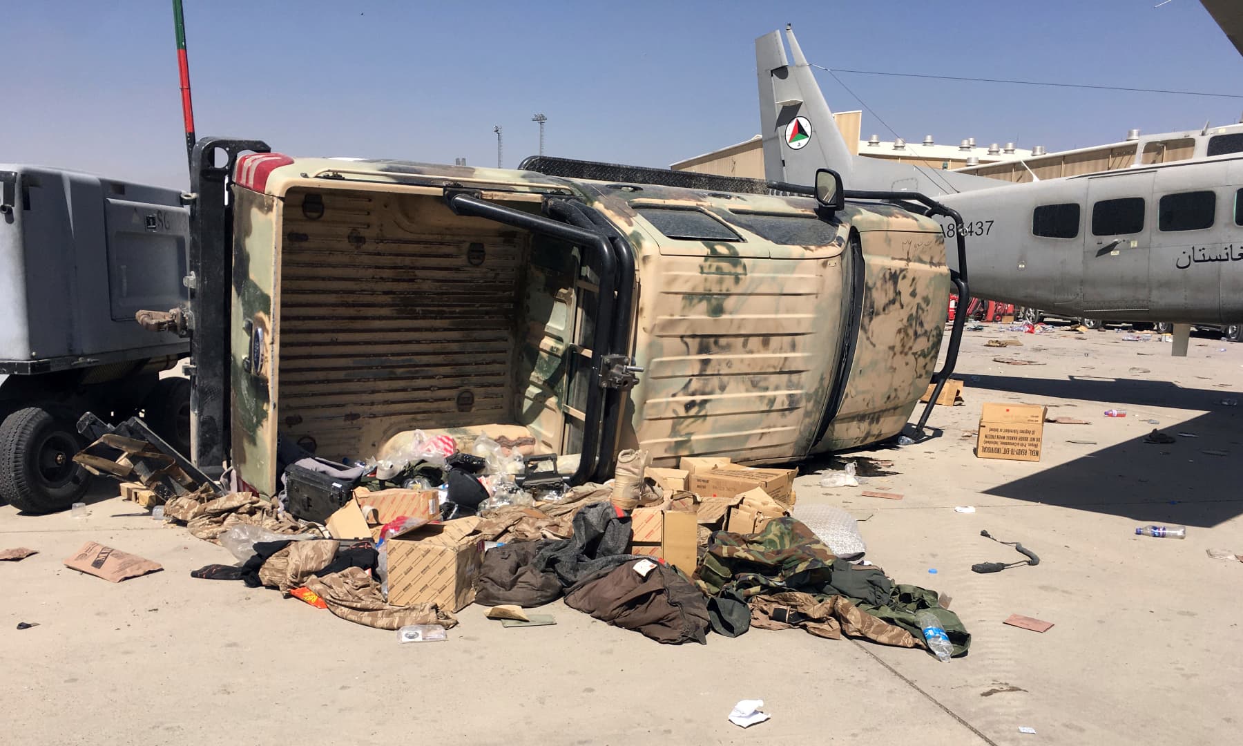 A damaged Afghan military airplane and vehicle are seen after the Taliban's takeover inside the Hamid Karzai International Airport in Kabul, Afghanistan on September 5, 2021. — AP