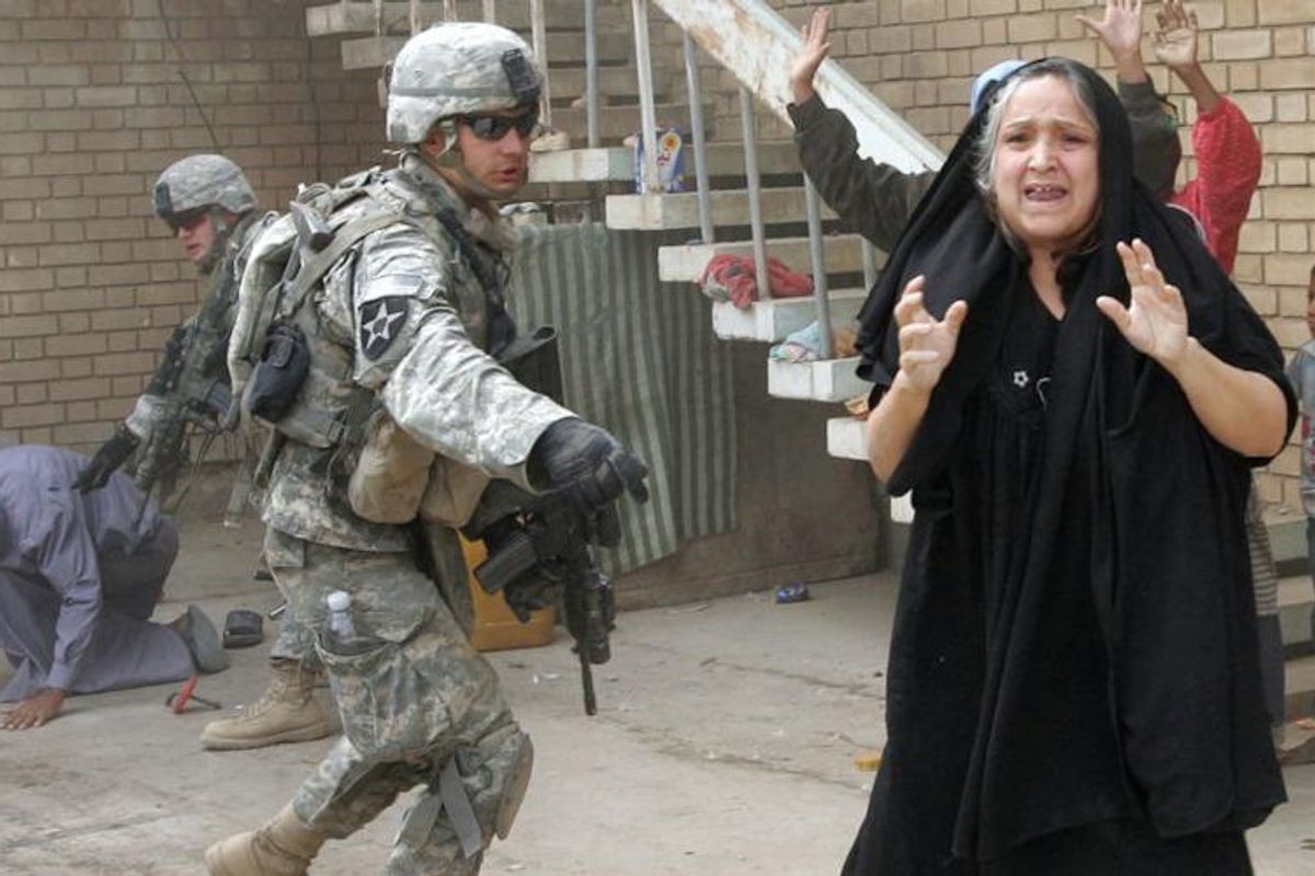 u-s-troops-terrorize-an-iraqi-woman-while-searching-her-husband-and-son-near-baquba-on-october-5-2007-photo-alexander-nemen.jpg
