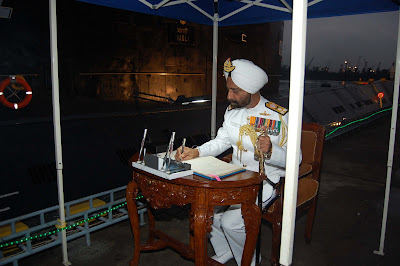 Vice_Admiral_Anup_Singh_isigns_the_Visitors__Book_of_Vagli-750665.jpg