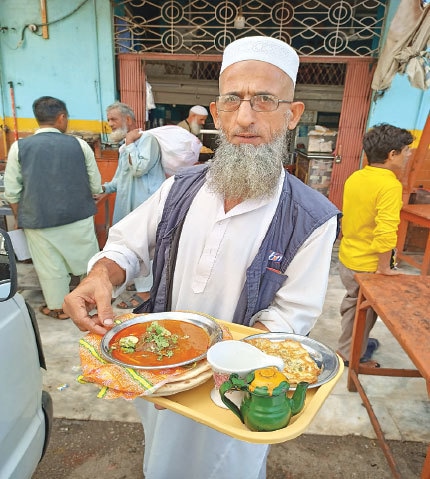 Waiter Sufi still going strong after 40 years at the New Bombay Restaurant | Photos by Zubair Shah