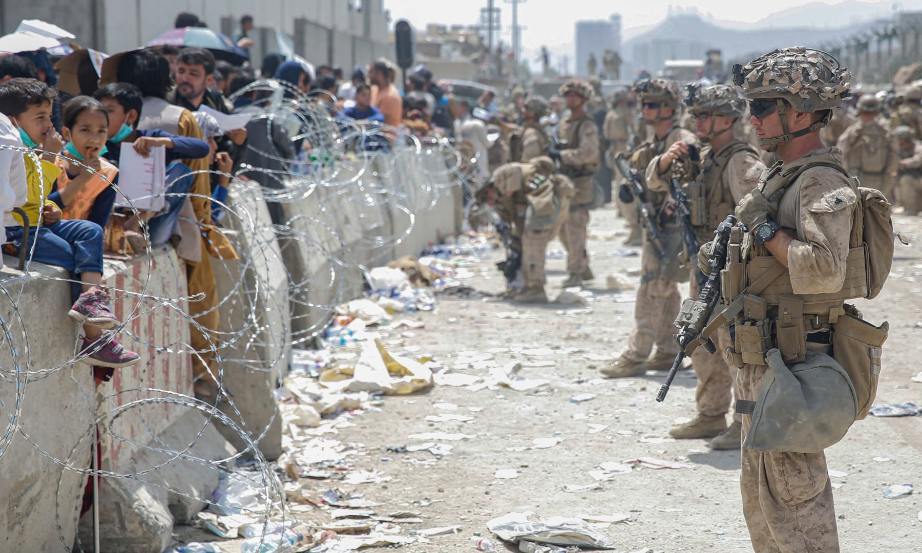 US Marines with Special Purpose Marine Air-Ground Task Force - Crisis Response - Central Command, provide assistance during an evacuation at Hamid Karzai International Airport in Kabul, Afghanistan on August 20, 2021. — AP
