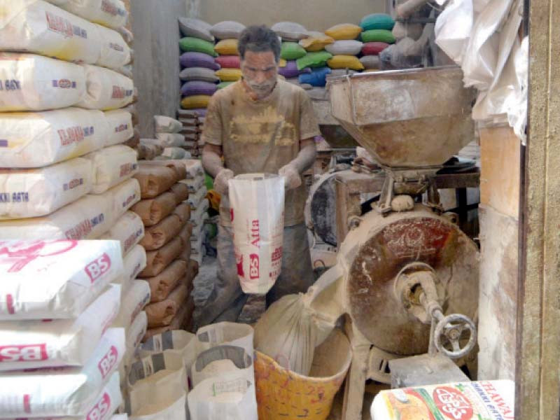 a worker grinds wheat at a shop in the saddar area of karachi to make whole grain flour grocery stores are retailing a 5kgs bag of flour for rs600 to rs750 against previous rates of rs550 photo jalal qureshi express