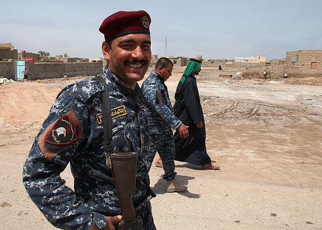 640px-Iraqi_policeman_patrols_the_K9_station_in_Basrah.jpg