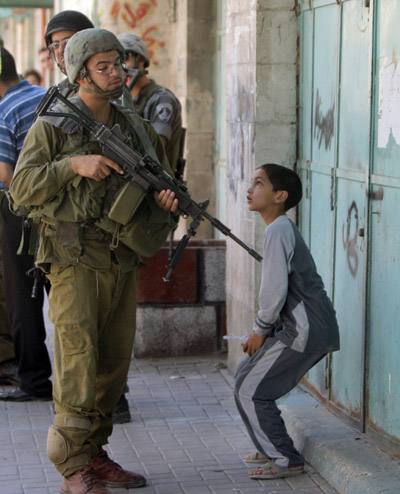 palestinian-boy-israeli-soldier.jpg