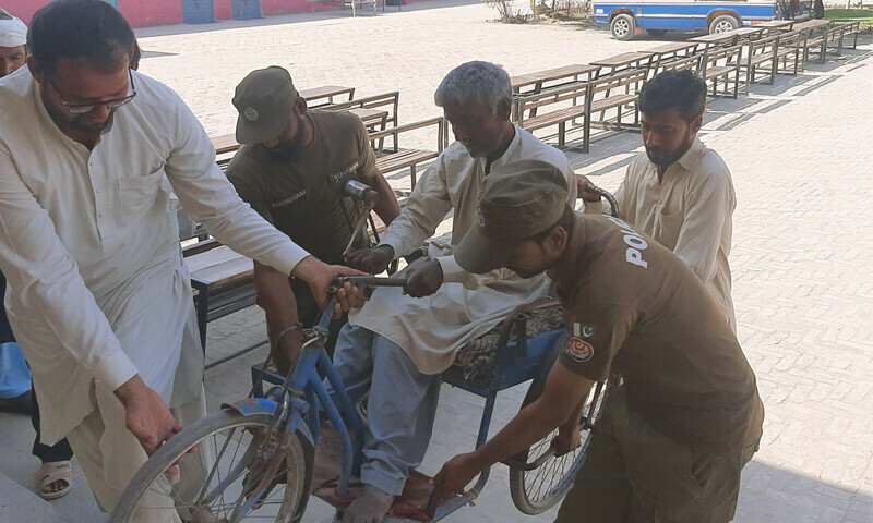 <p>A disabled man is helped to a polling station in this photo posted by the Punjab Police on Sunday.—<a rel=noopener noreferrer target=_blank class=link--external href=https://twitter.com/OfficialDPRPP>@OfficialDPRPP</a></p>