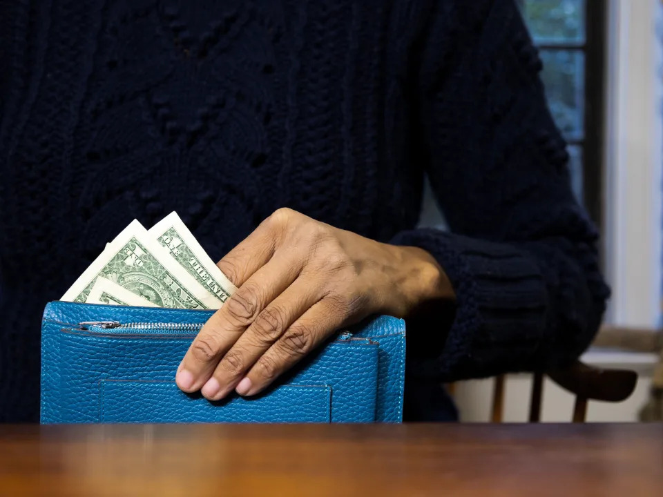 woman holding cash
