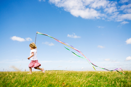 young-girl-playing-with-kite.jpg