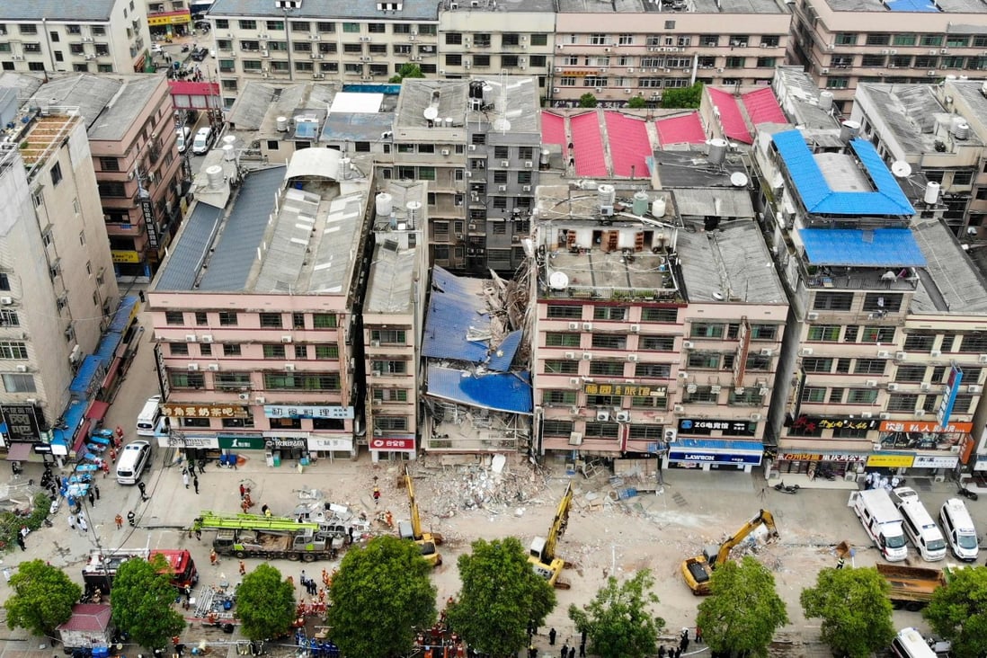 About two dozen fire trucks attend the scene of a building collapse in Changsha on Friday. Photo: CNS/AFP/China OUT