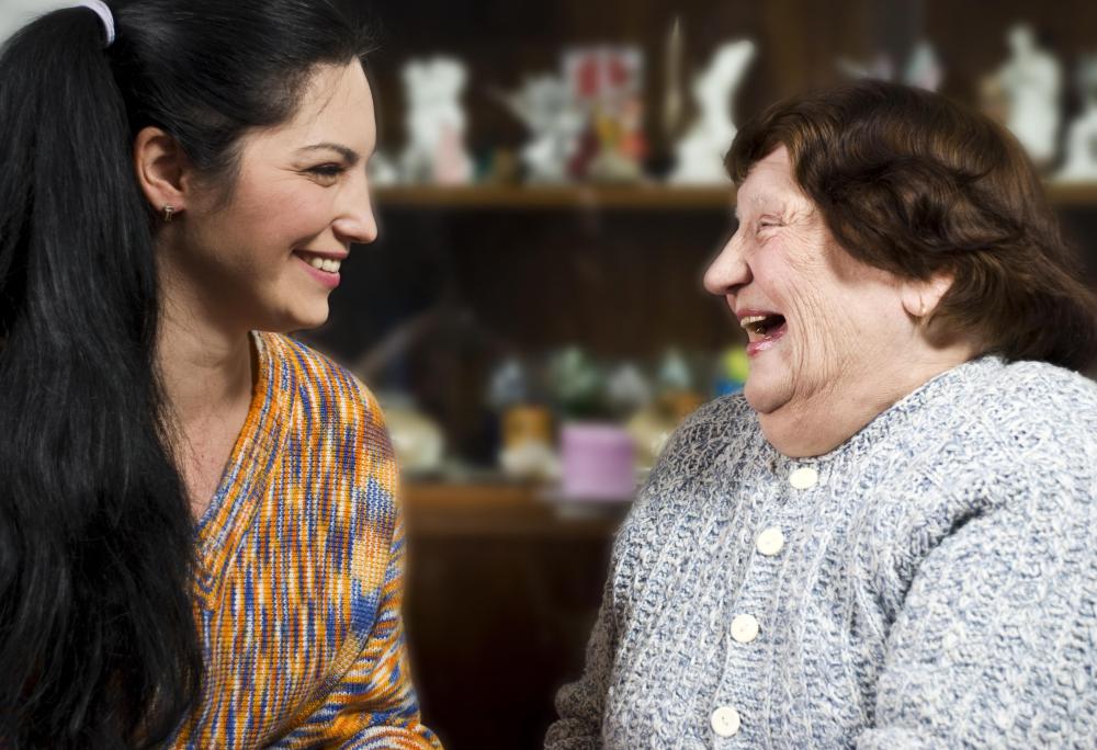 older-woman-in-gray-laughing-with-younger-woman-with-black-hair.jpg