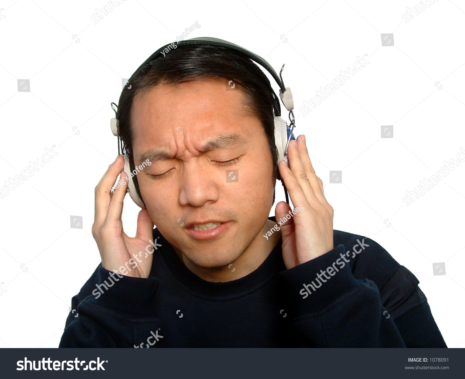 stock-photo-one-chinese-man-enjoying-listening-to-music-through-his-headphones-isloated-1078091.jpg