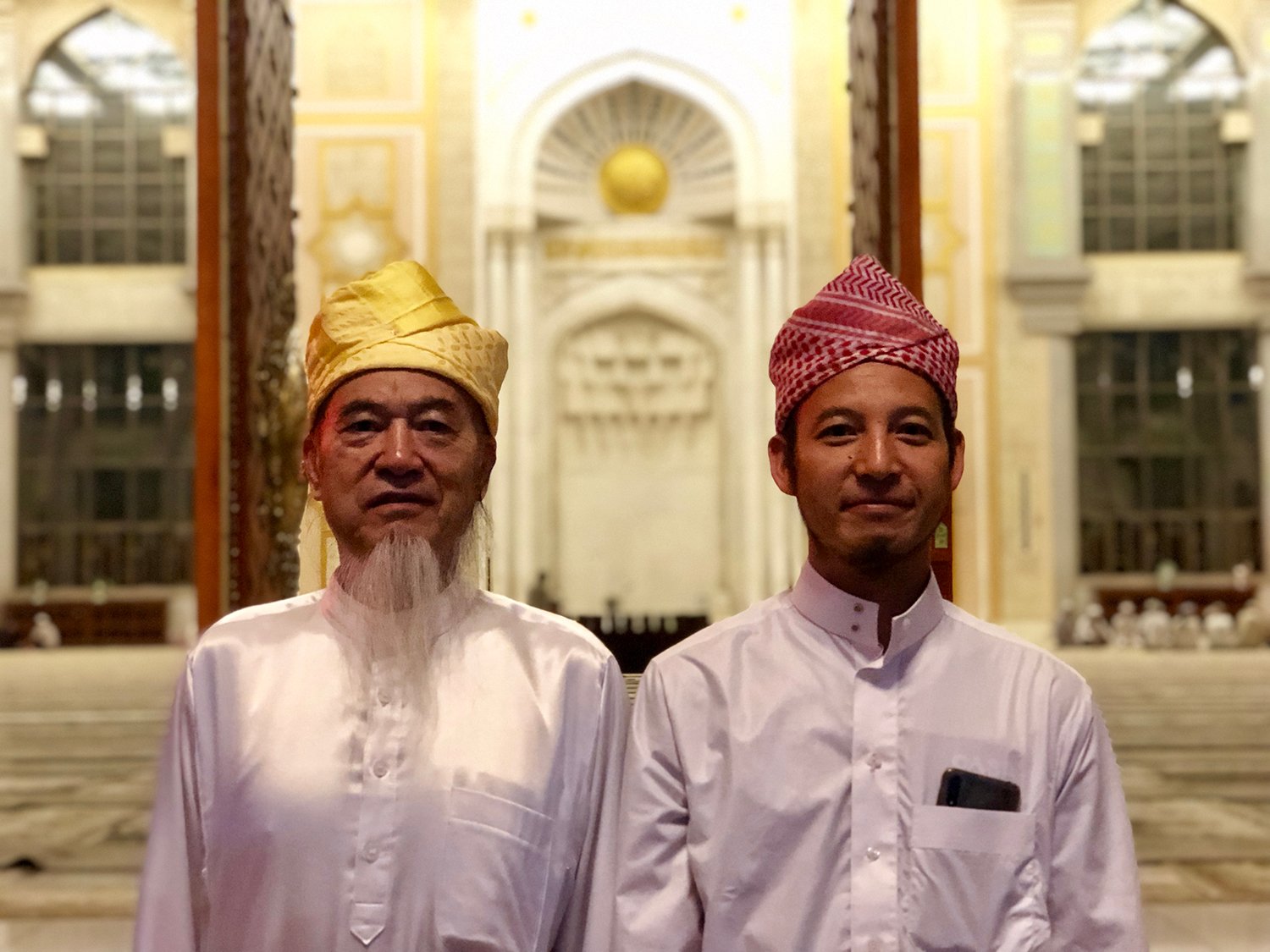 Two imams outside the Grand Mosque in Shadian, China.