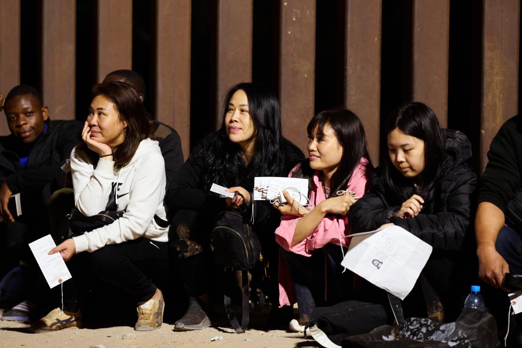 Chinese migrants surrendered to U.S. Customs and Border Protection officers after crossing the U.S.