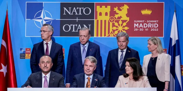 NATO's secretary general along with the leaders and foreign ministers of Turkey, Finland, and Sweden in Madrid, Spain, on June 28, 2022.