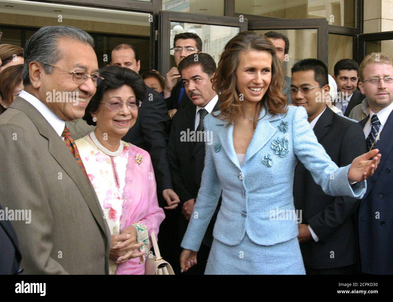 mrs-asma-al-assad-first-lady-of-syria-welcomes-mahathir-mohamad-former-prime-minister-of-malaysia-and-his-wife-during-the-opening-of-the-women-in-business-international-forum-2005-in-damascus-mrs-asma-al-assad-front-r-first-lady-of-syria-welcomes-mahathir-mohamad-front-l-former-prime-minister-of-malaysia-and-his-wife-during-the-opening-of-the-women-in-business-international-forum-2005-in-damascus-may-21-2005-the-conference-is-held-for-the-first-time-out-of-its-headquarters-in-london-and-will-give-an-opportunity-for-650-businesswomen-leading-figures-and-international-delegation-2CPKD30.jpg