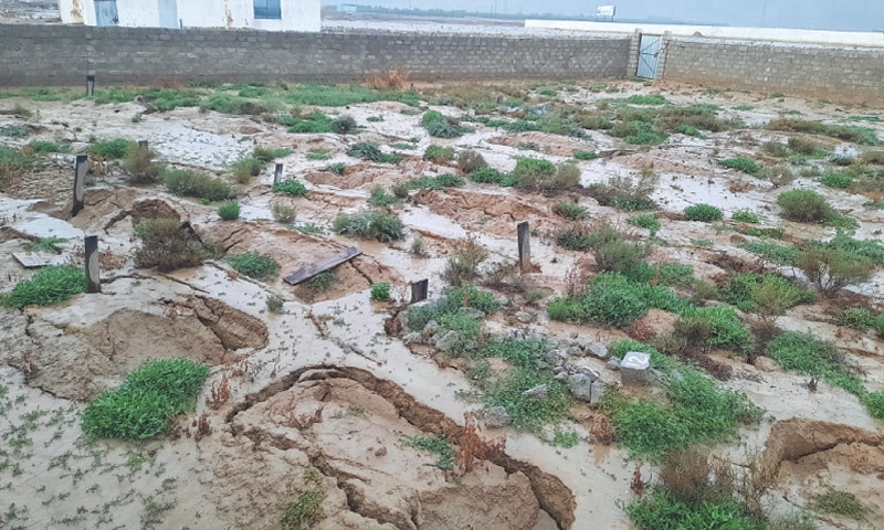 MASTUNG: A small cemetery known as Lawaris Qabristan, or graveyard of the forgotten, on a rainy day. Most of the graves are in a decrepit state due to rain and neglect.—Photo by the writer