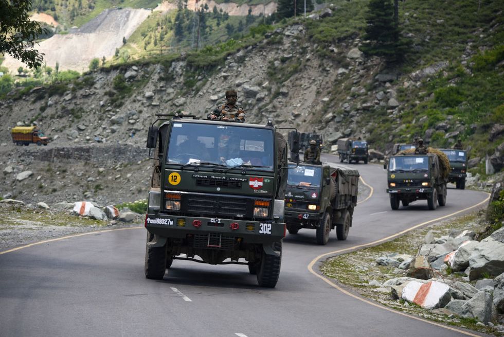 indian army convoy moves along the national highway leading