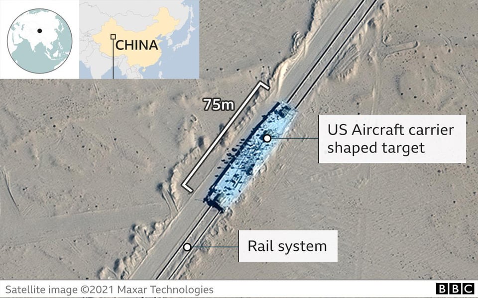 r/interestingasfuck - Just spotted by satellite: full-scale mock-up of a US aircraft carrier in a desert in NW China.