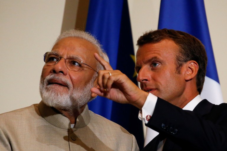 French President Emmanuel Macron gestures next to Indian PM Narendra Modi after a joint statement at the Chateau of Chantilly, near Paris, in this August 22, 2019 photo [File: Pascal Rossignol/Reuters]