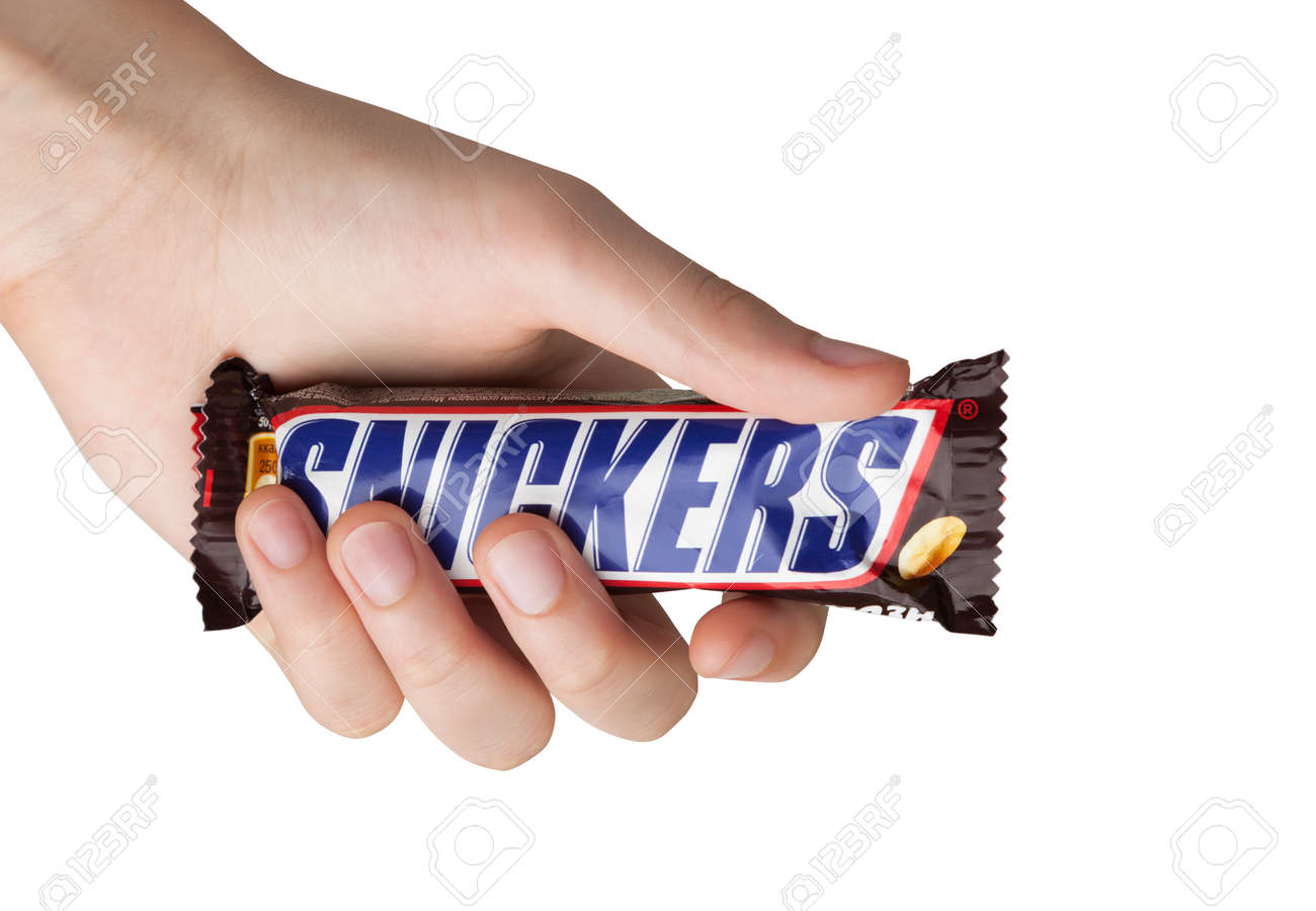 92221818-hand-holding-a-snickers-chocolate-bar.jpg