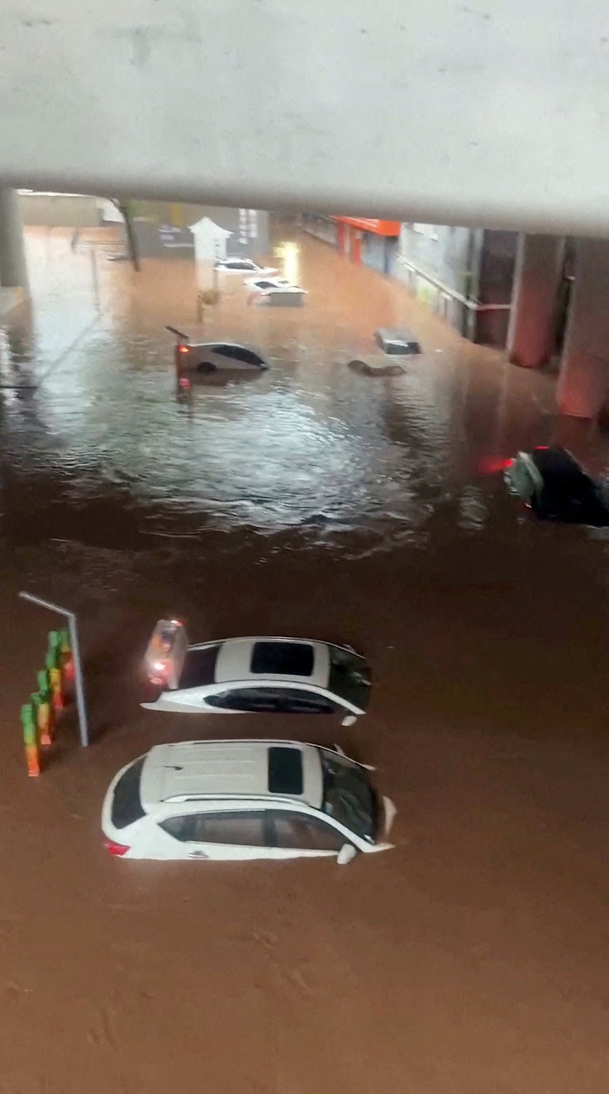 Cars were submerged by flash flooding on Wednesday. Photo: Reuters