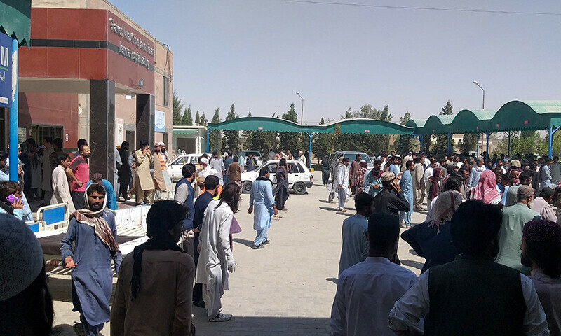People gather outside a Mastung hospital, following a deadly suicide attack on a religious gathering in Balochistan on September 29 in this handout image. — Reuters