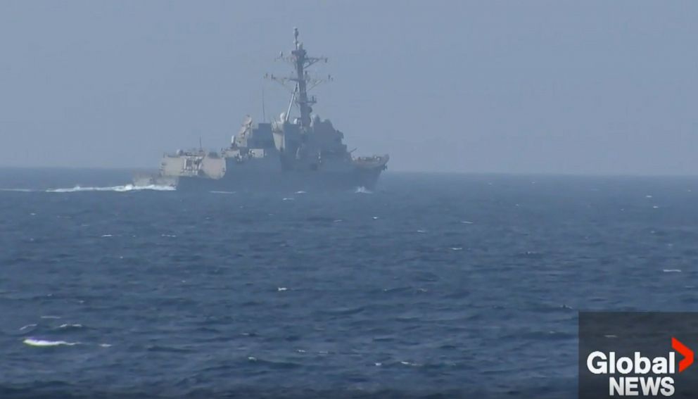 A Chinese warship appears to have intercepted the pair of U.S. and Canadian ships transiting through the Taiwan Strait overnight.