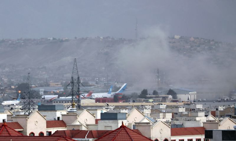 Smoke rises from explosion outside the airport in Kabul, Afghanistan, on Thursday. — AP