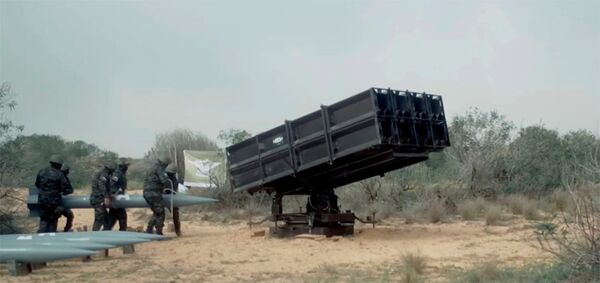 Loading of A-120 rockets into a multiple rocket launcher