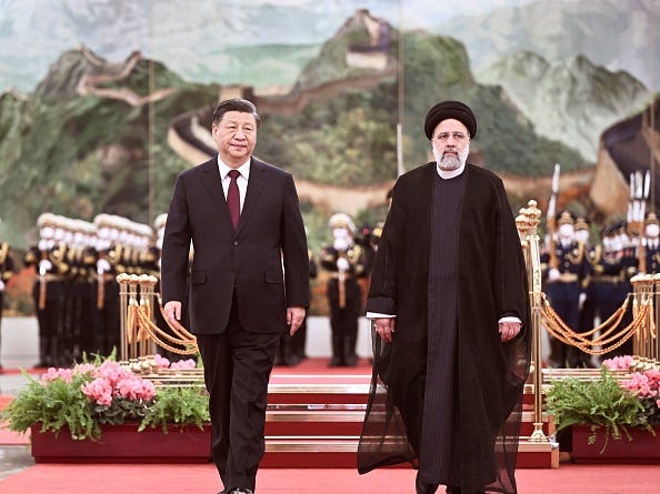 Chinese President Xi Jinping holds a welcoming ceremony for visiting President of the Islamic Republic of Iran Ebrahim Raisi prior to their talks at the Great Hall of the People in Beijing, capital of China, Feb. 14, 2023.