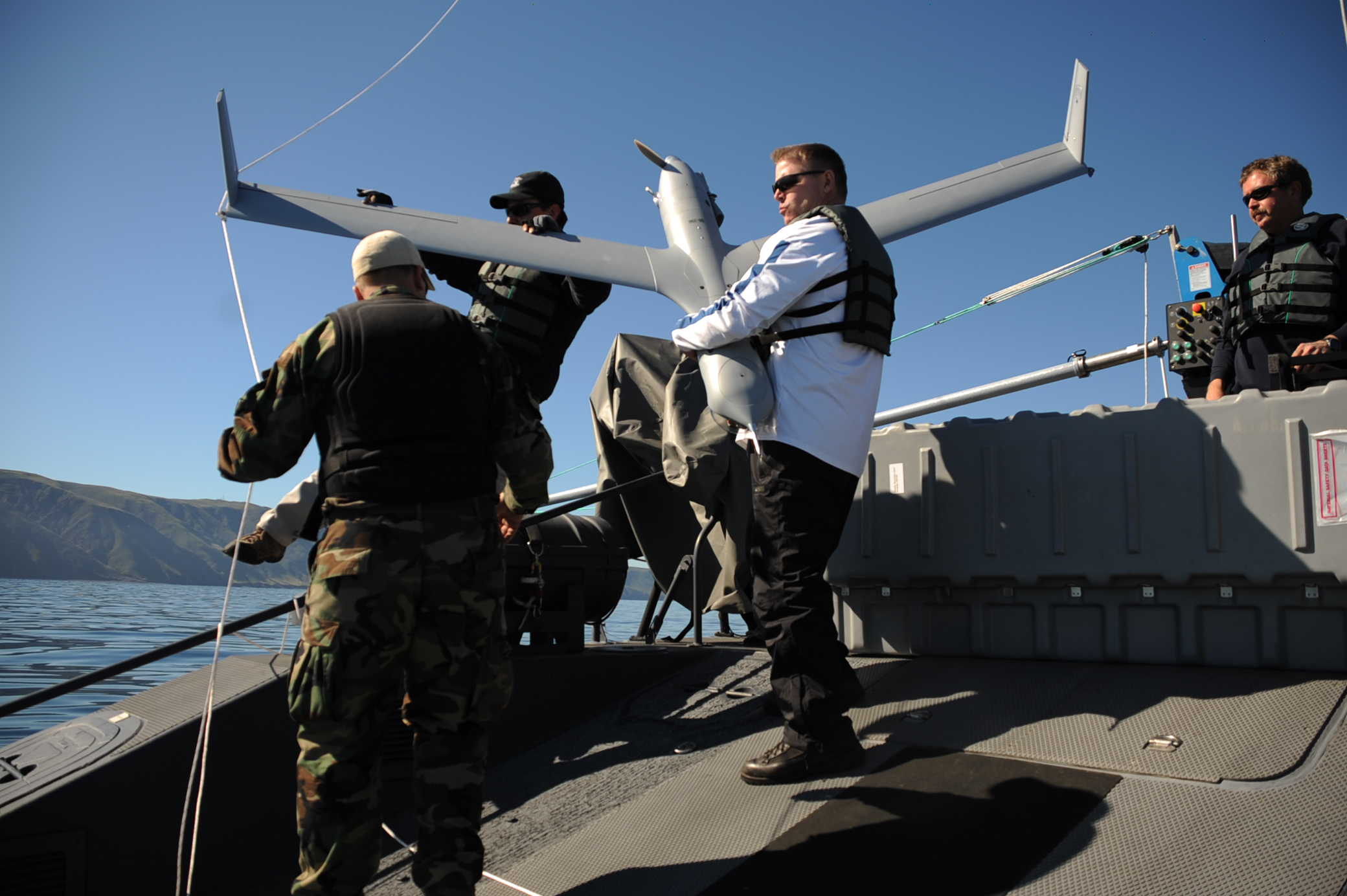US_Navy_080207-N-5366K-519_Civilian_contractors_recover_a_Scan_Eagle_unmanned_aerial_vehicle_launched_from_a_MK_V_naval_special_warfare_boat_off_the_coast_of_San_Clemente_Island.jpg