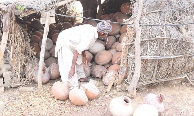 Khoso buys his pitchers from Hussain Kumbher, a local potter. — Photo by Zulfiqar Khoso