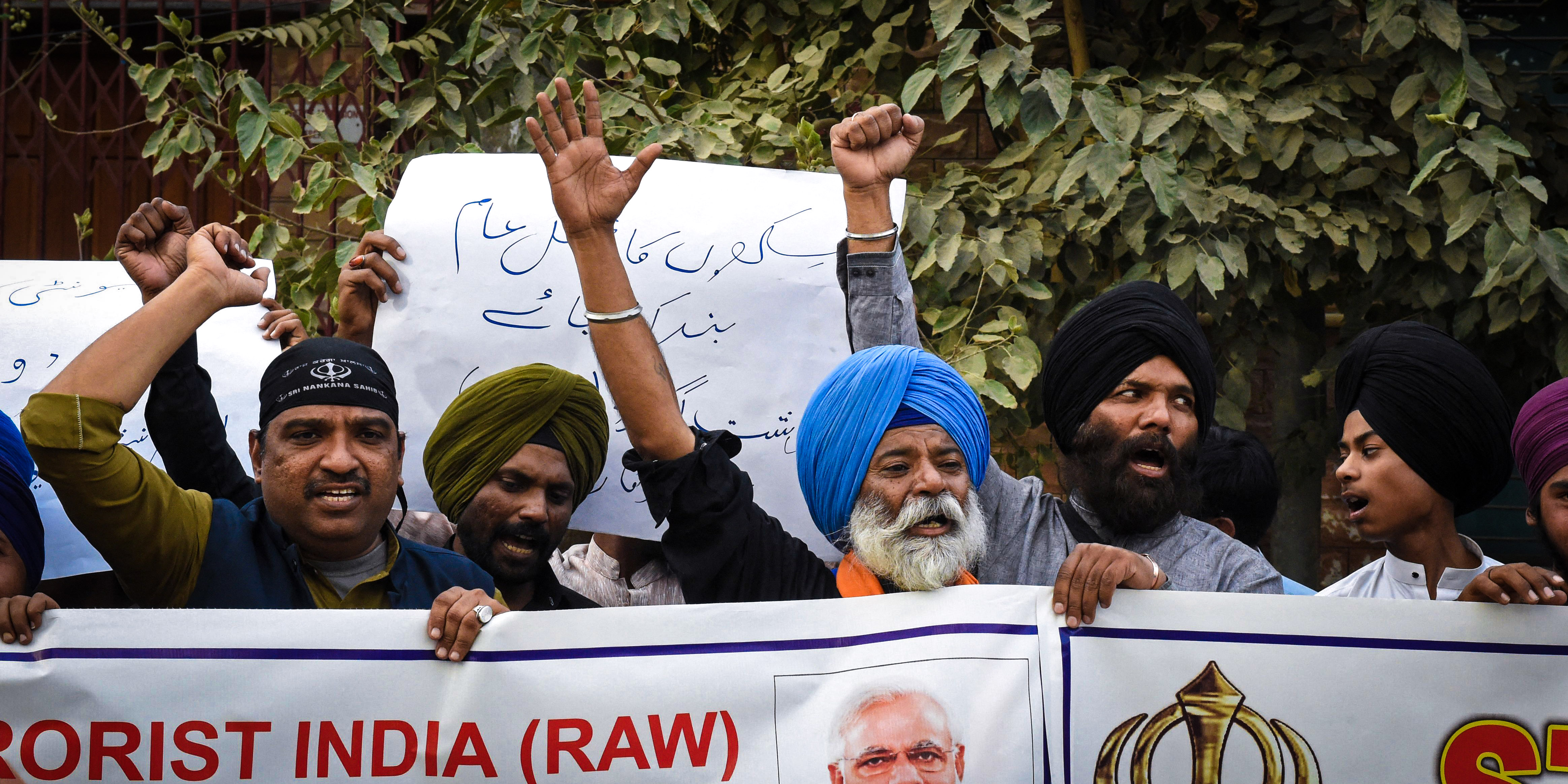 Members of Pakistan's Sikh community shout slogans as they hold banners during a protest in Quetta on September 23, 2023, to condemn the killing of a Sikh separatist Hardeep Singh Nijjar in Canada. India's historic adversary Pakistan said on September 21, that Western nations had failed to see the reality of New Delhi's right-wing leadership after Canada alleged Indian involvement in a killing. Canada expelled an Indian diplomat, prompting a tit-for-tat reaction, after concluding that Indian agents played a role in the June killing near Vancouver of a Sikh separatist, Hardeep Singh Nijjar. (Photo by Banaras KHAN / AFP) (Photo by BANARAS KHAN/AFP via Getty Images)