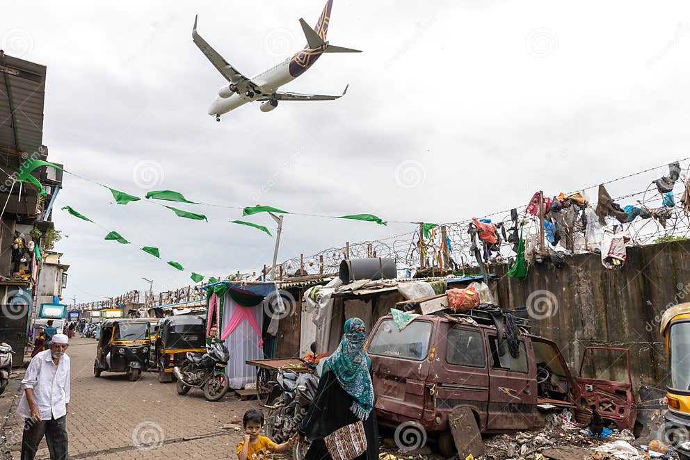 mumbai-india-slums-hutments-very-near-to-walls-mumbai-international-airport-landing-take-off-location-slums-254258724.jpg