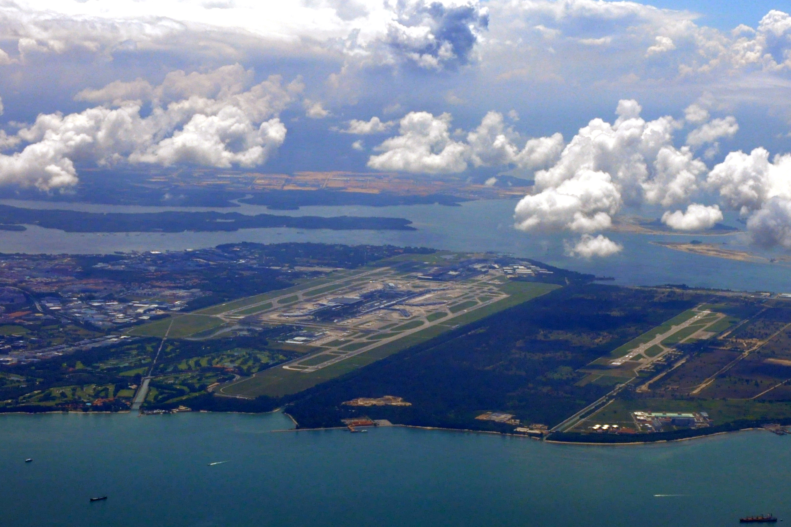 Aerial_view_of_Singapore_Changi_Airport_and_Changi_Air_Base_-_20110523.jpg