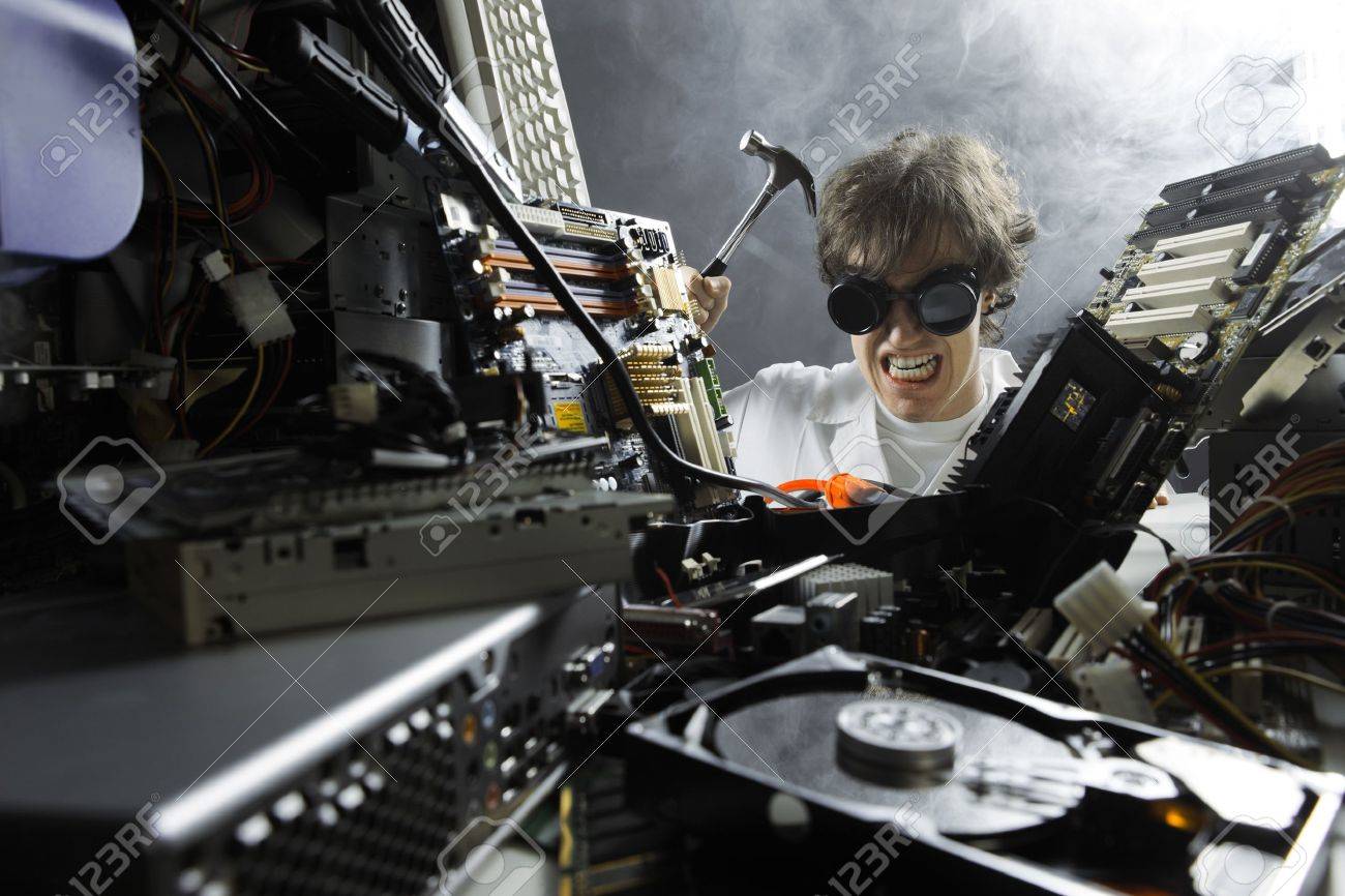 20143158-Crazy-computer-technician-is-trying-to-repair-a-computer-Stock-Photo.jpg