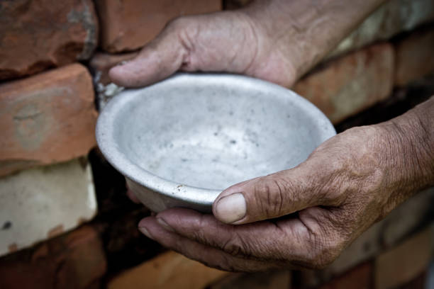 the-poor-old-mans-hands-hold-an-empty-bowl-the-concept-of-hunger-or-poverty-selective-focus.jpg