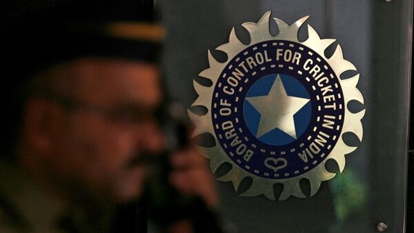 A policeman walks past a logo of the Board of Control for Cricket in India (BCCI) during a governing council meeting of the Indian Premier League (IPL) at BCCI headquarters in Mumbai April 26, 2010. (REUTERS)
