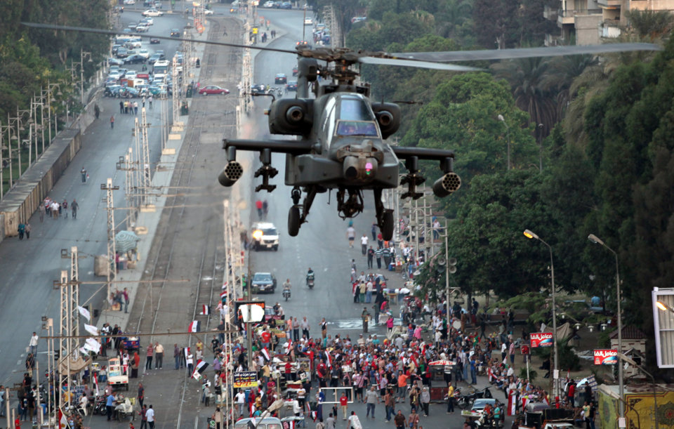 AH-64+AD+military+attack+helicopter+flies+over+a+street+near+presidential+palace%252C+in+Cairo%252C+Egypt+%25284%2529.jpg